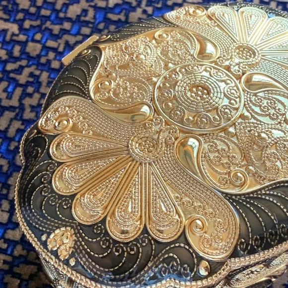 Absolutely stunning jewelry box , golden and black top, made in UAE. Must have!